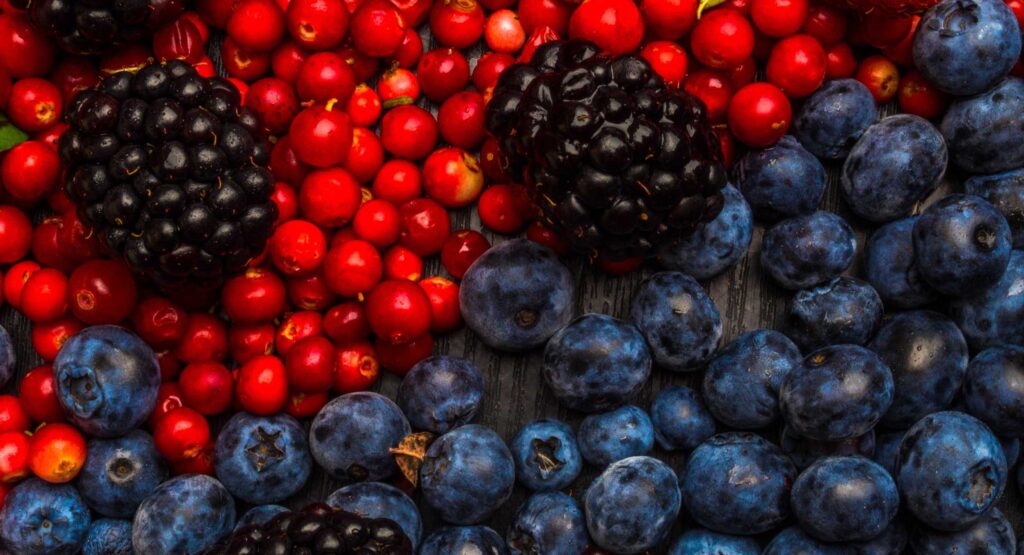 grapes and berries in a table