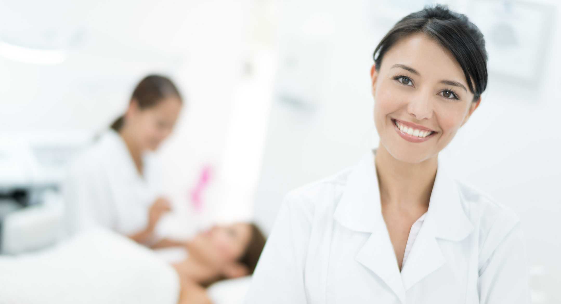 Happy woman doing skincare procedure